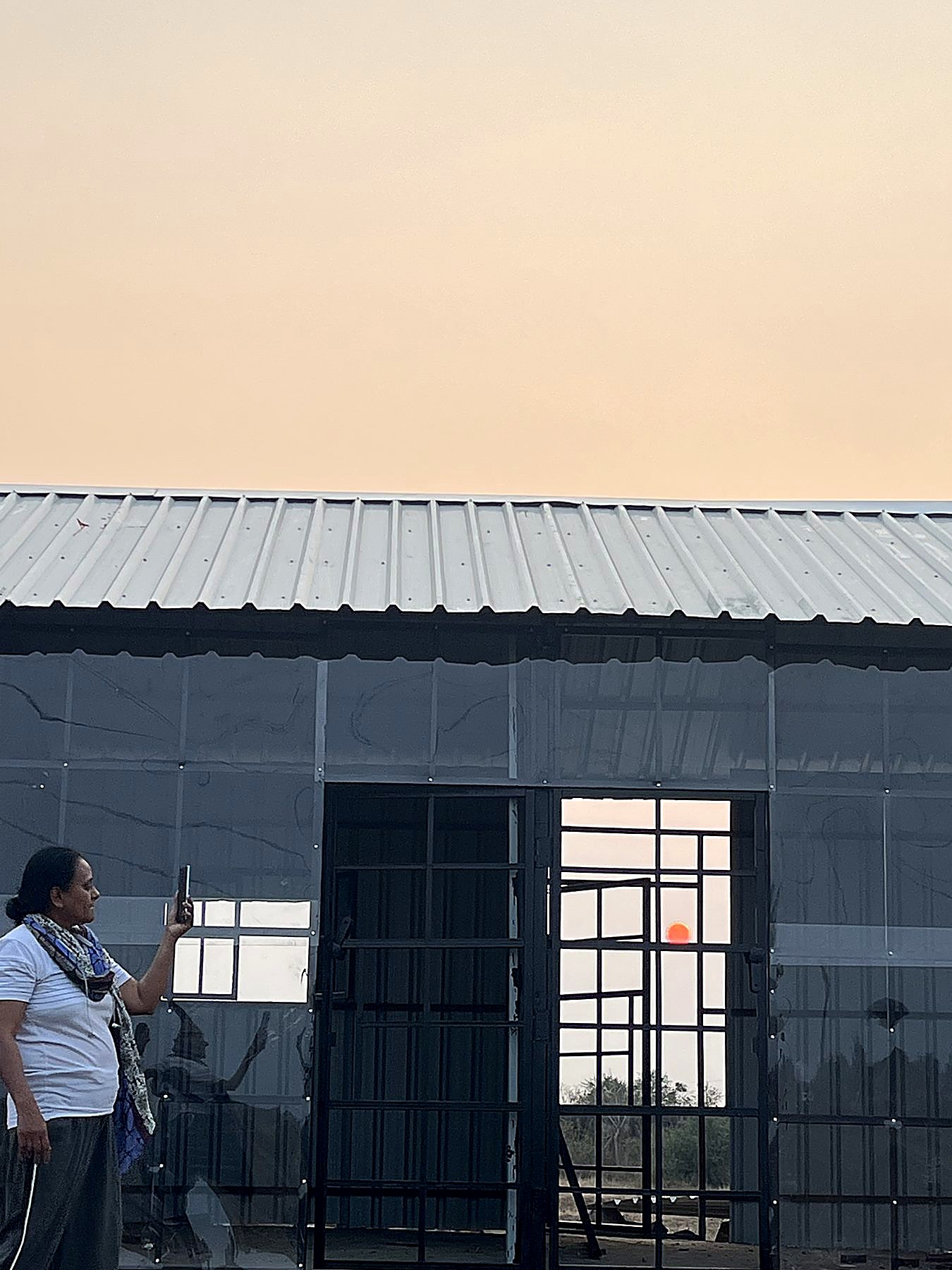 A founder capturing the moment as the structure finally takes shape