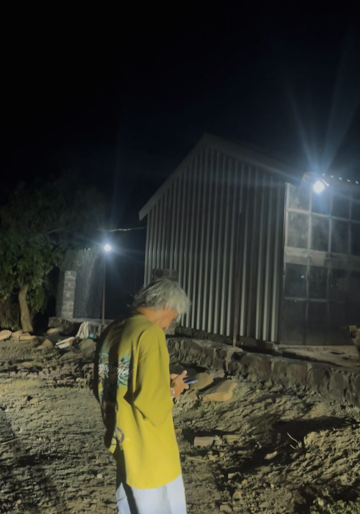 The shelter at night — work continuing past sundown
